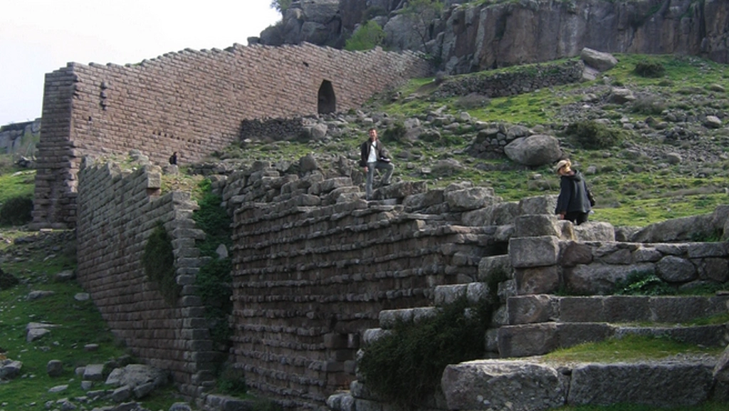 Students on stone steps at ancient city site
