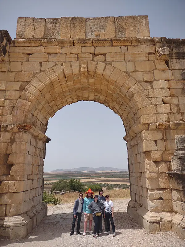 UT classics students looking cool under the Arch of Caracalla at Volubilis, Morocco. 