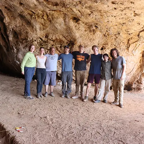 The excavation team poses for a group photo in the Megalos Peristeres Cave, Crete.