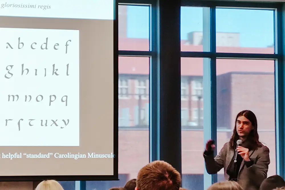 Associate Professor Charles Kuper speaks to Tennessee high school students during Latin Day.