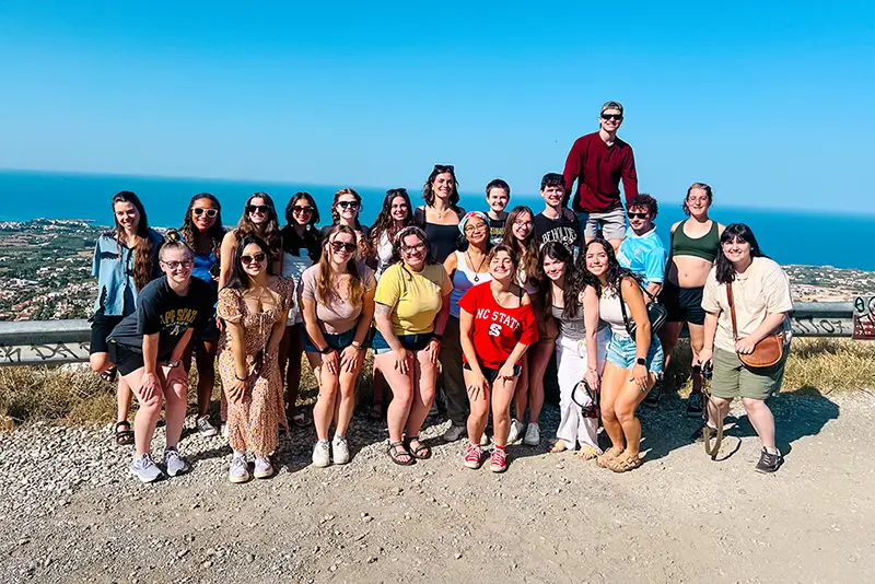Gabby Puckett, undergraduate student in the Department of Classics takes a photo with a group of students studying abroad in Cyprus. 